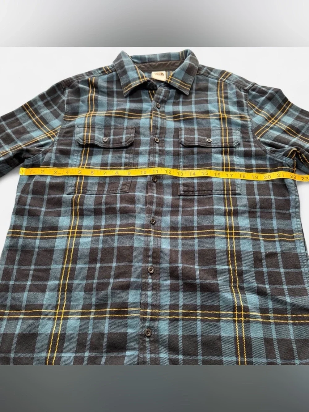 The North Face Blue and Black Plaid Button-Down Shirt with Yellow Stripes